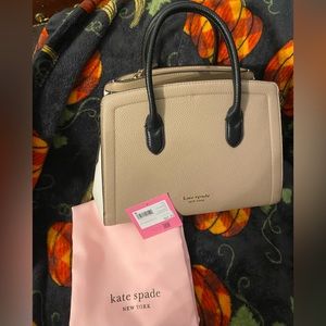 NWT Limited series knotted Kate Spade purse with dust bag.